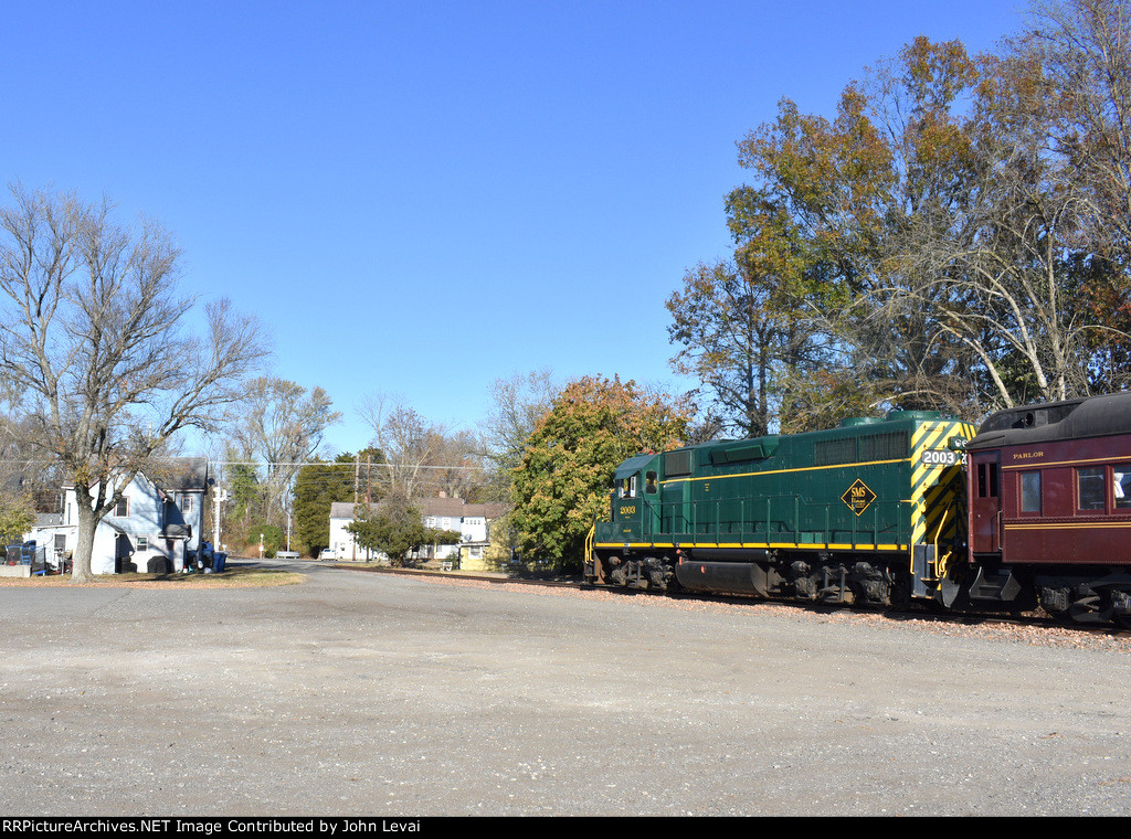 Now the diesel consist gets its turn-proud 2003 leads the train toward the Bailey St grade crossing 